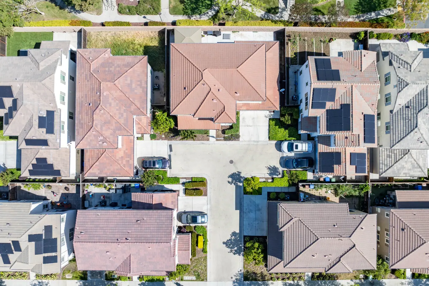 Top-down aerial view of single-family homes and residential lots