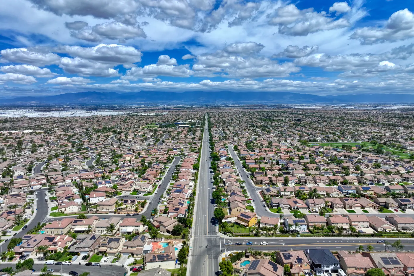 Aerial view of Eastvale in Riverside County showing residential neighborhoods, major roads, and mountains